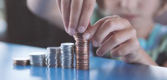 Photo of child stacking coins