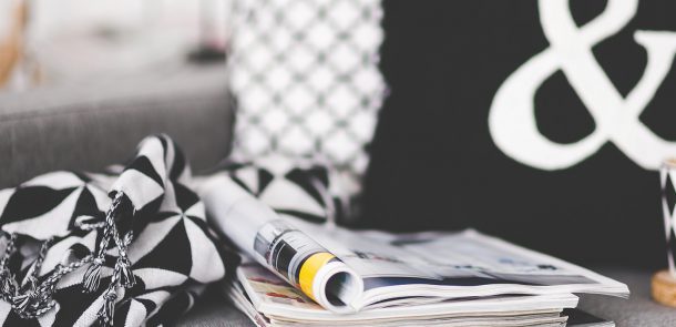 Black and white blanket and cushions decorate sofa nicely