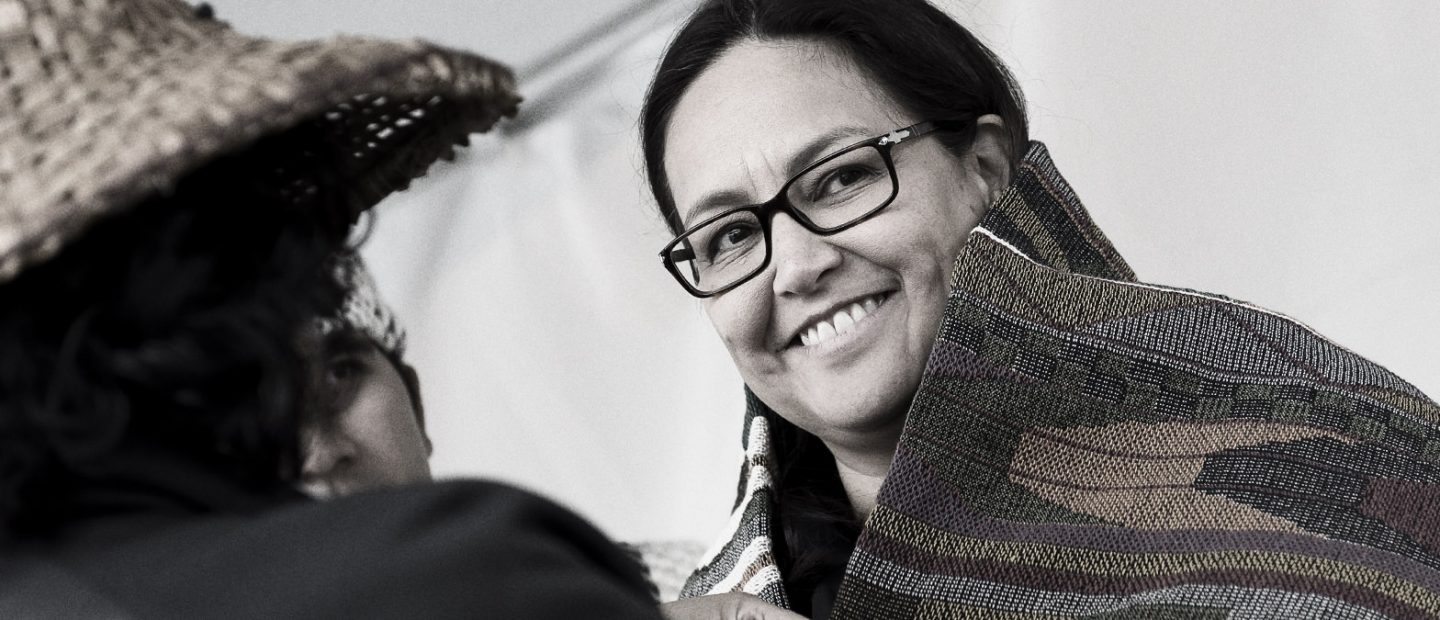 rst nation woman smiling at Act of reconcilation