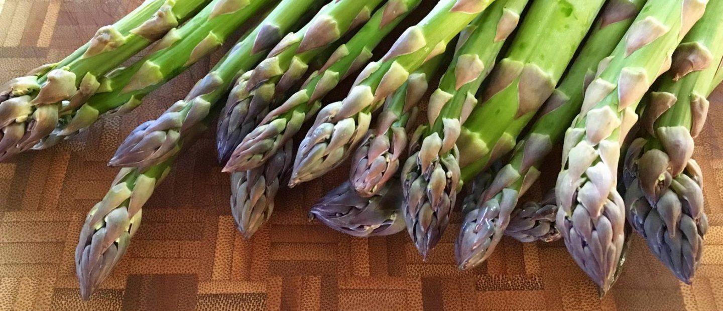 Fresh green asparagus atop a table