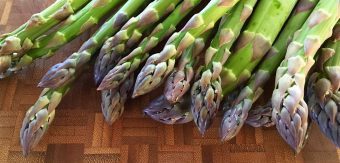 Fresh green asparagus atop a table