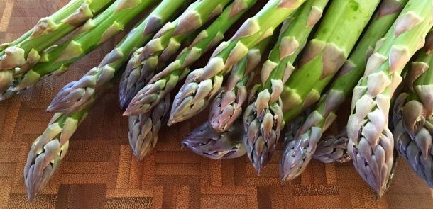 Fresh green asparagus atop a table