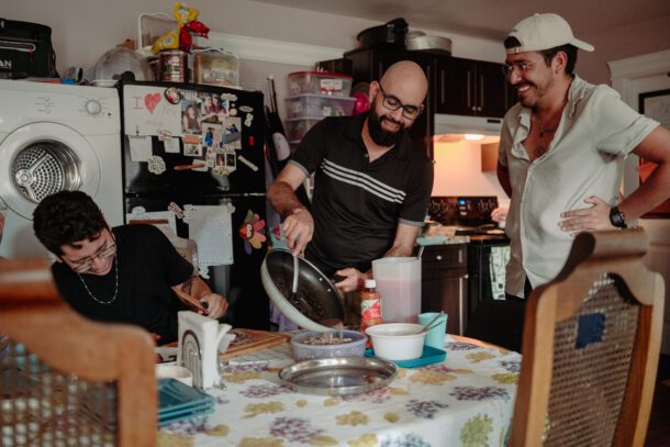 Refugee Claimant Family making dinner together in their permanent home.
