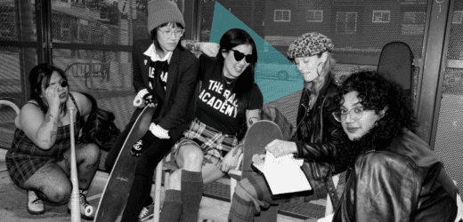 Black-and-white photo of Amanda Kao at the center with a group of women and gender-diverse individuals, some holding skateboards, wearing punk-inspired outfits. 'The Bad Academy' is printed on their shirts, reflecting creativity and community.